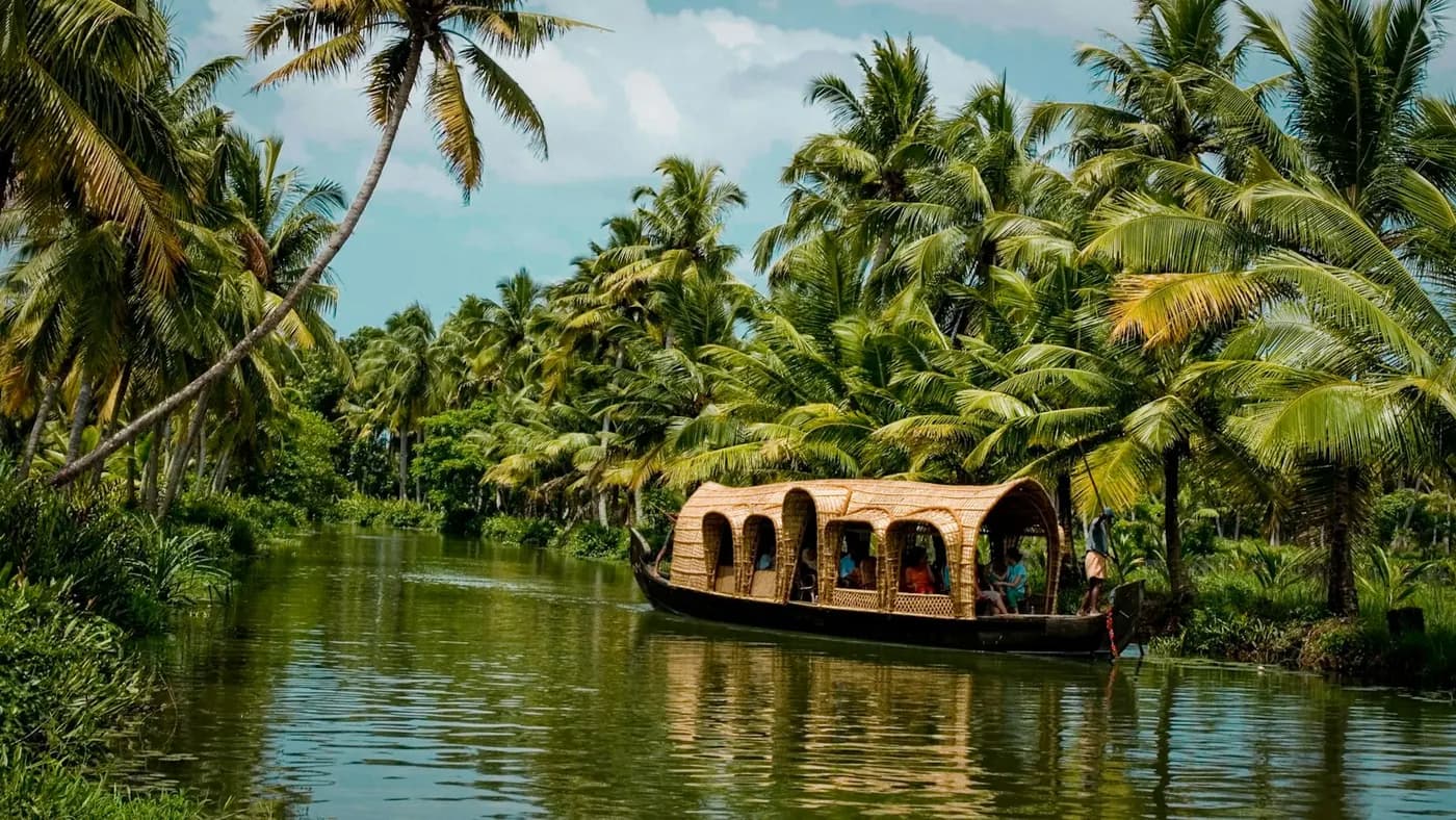 Houseboat on a palm-lined Kerala backwater